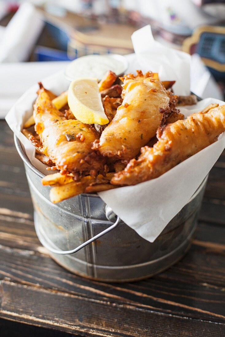 Fish and chips in a small bucket