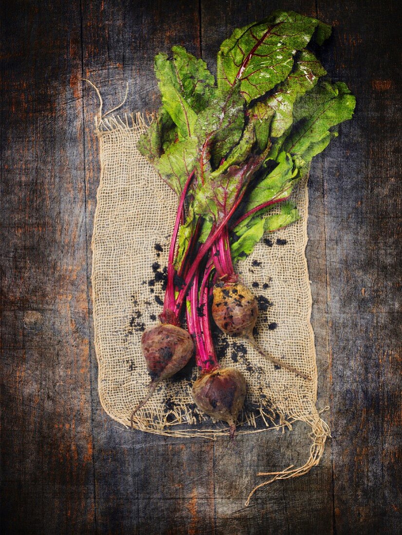 Fresh beetroots on piece of jute