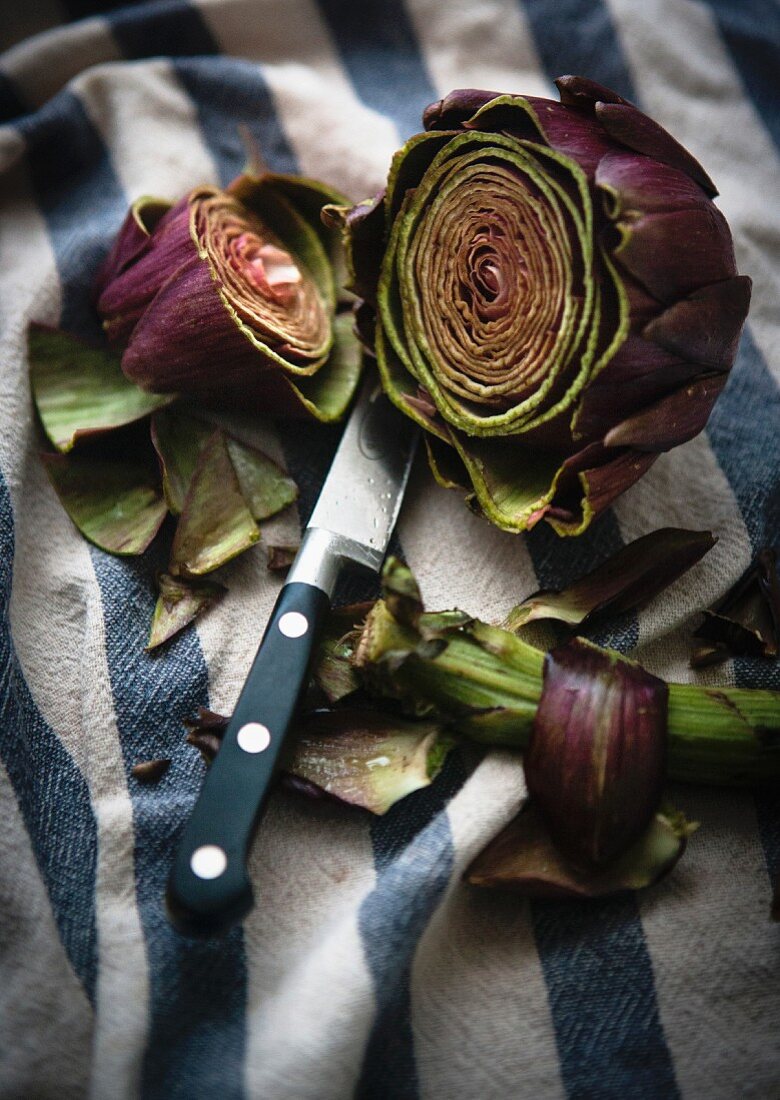 An artichoke being prepared