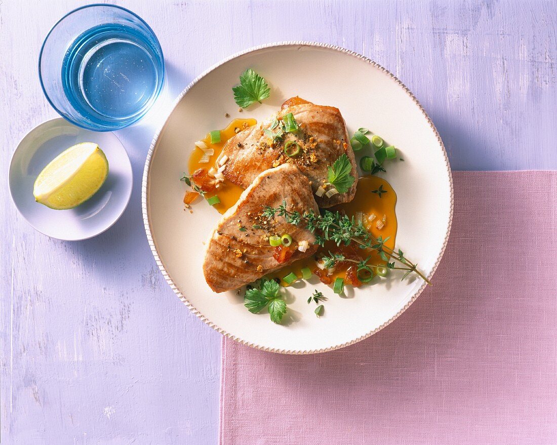Tuna fish fillets with herbs and a date sauce