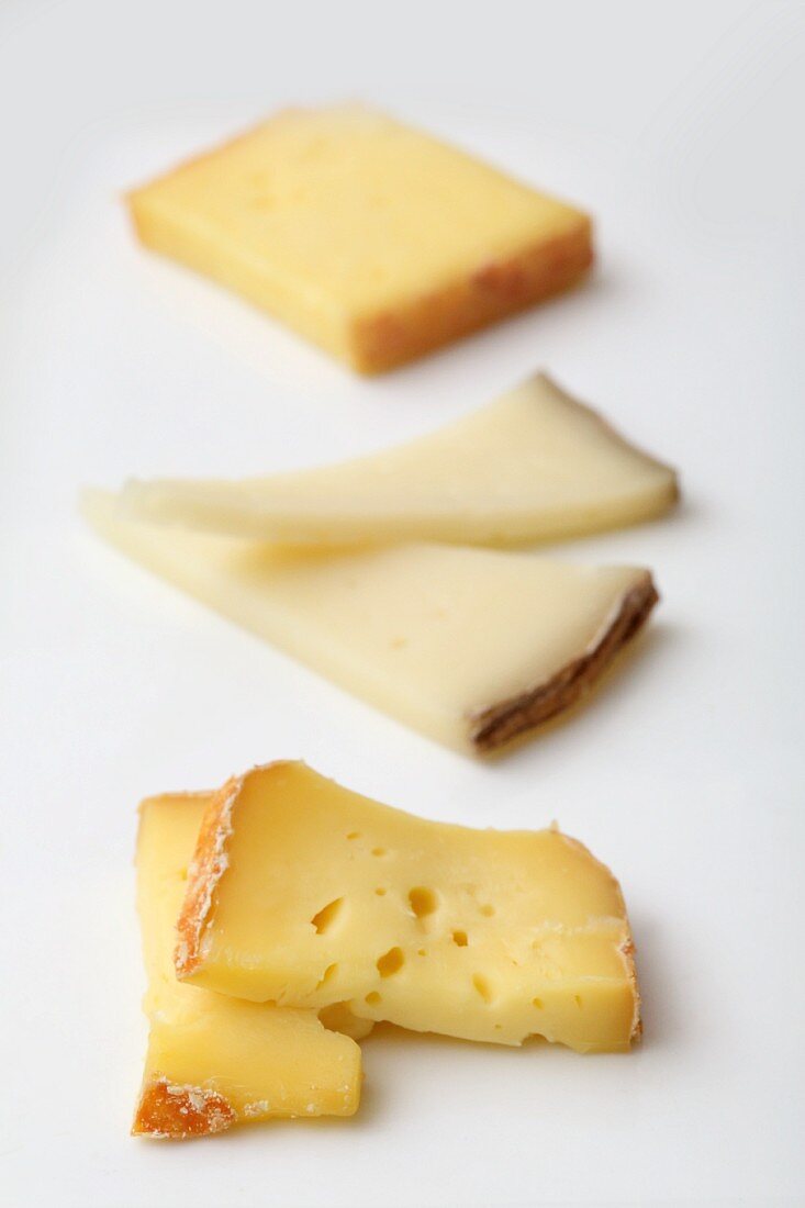 Three types of sliced cheese