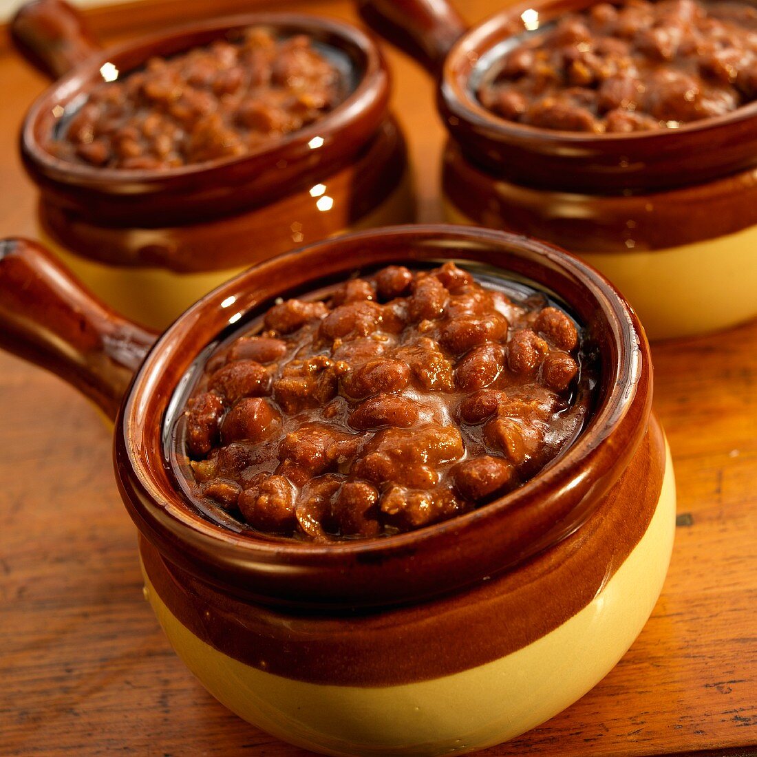 Three bowls of chilli with beans