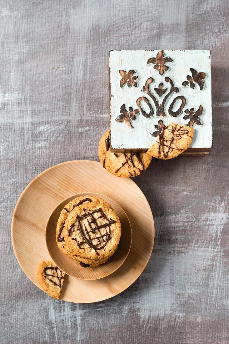 Oat biscuits with chocolate and a wooden box