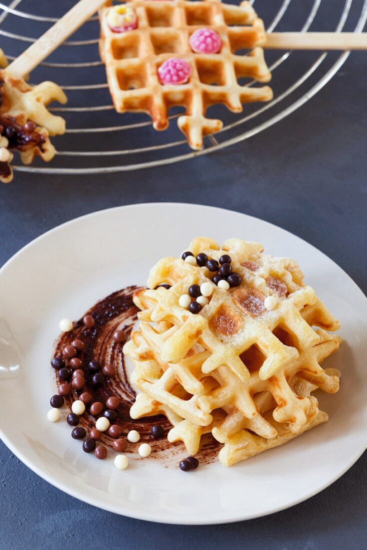Waffles with chocolate balls and raspberry sweets