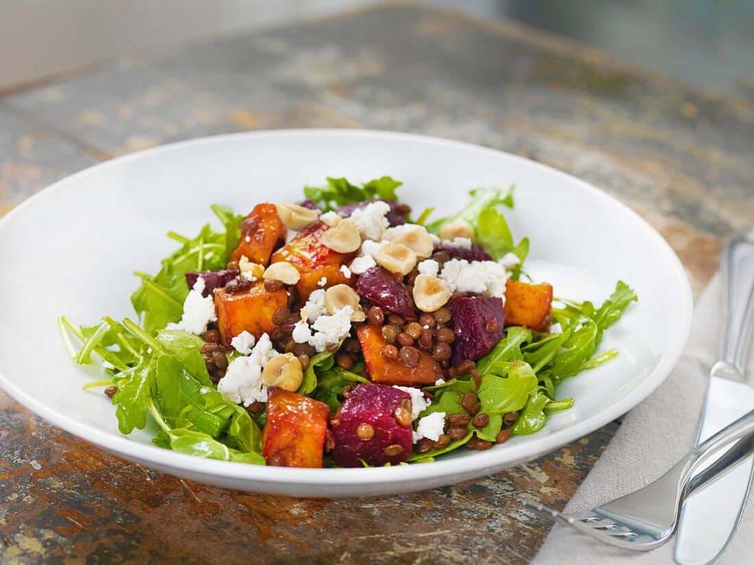Lentil salad with rocket, beetroot, sweet potatoes, feta cheese and hazelnuts