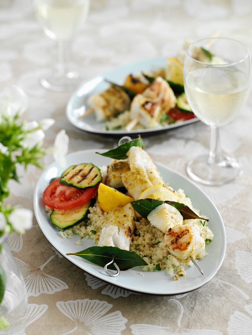 Fish skewers on couscous