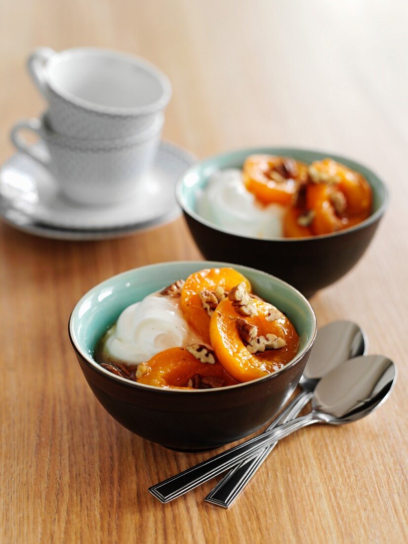 Quark with poached apricots, pecan nuts and maple syrup