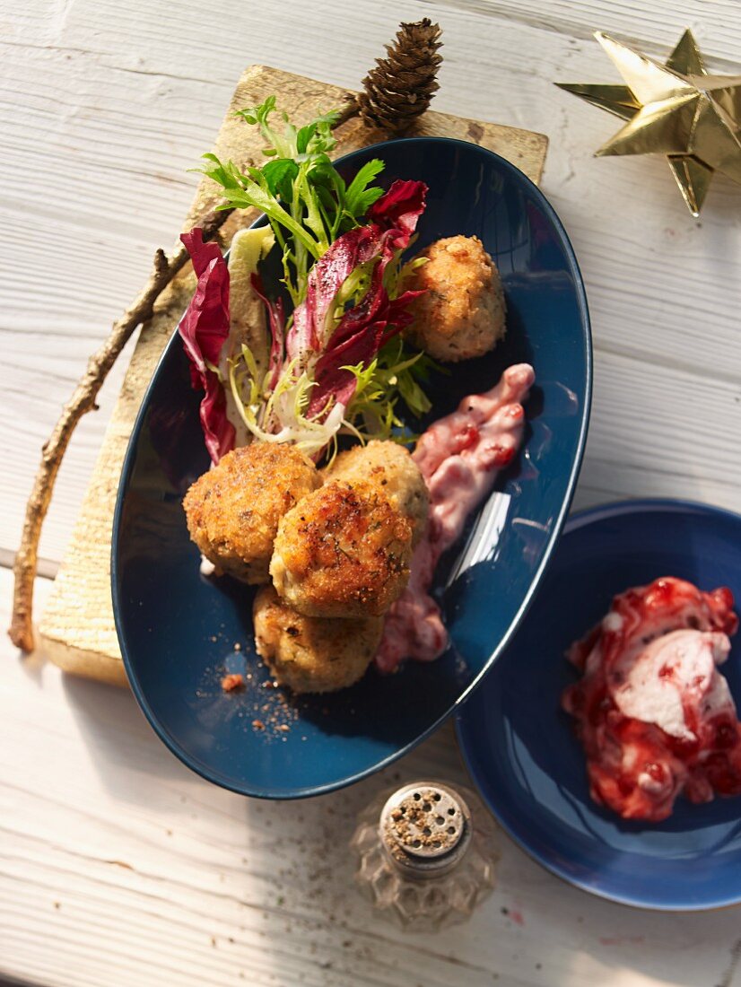 Codfish balls with a mixed leaf salad and lingonberries (Sweden)