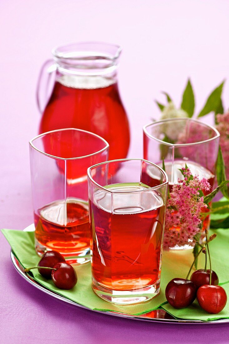 Cherry juice in glasses and a jug