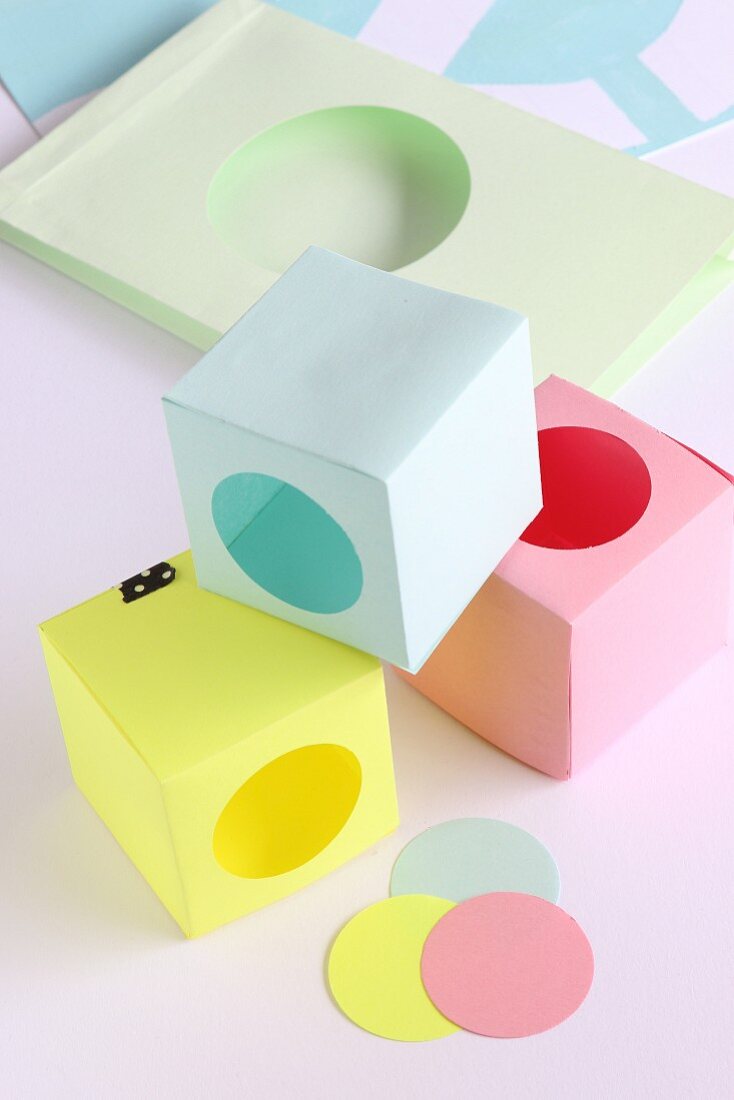 Hand-crafted paper boxes with punched, circular openings