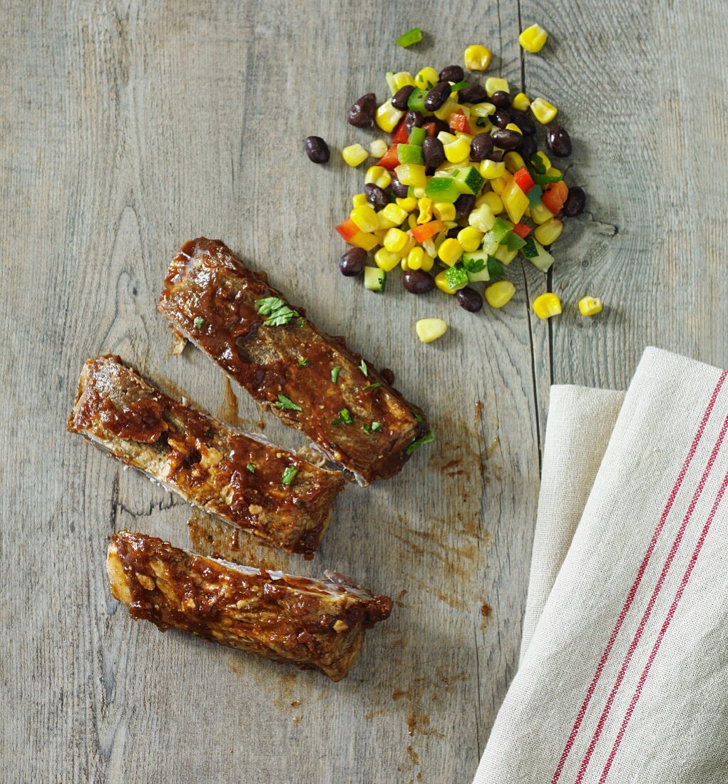 Spare ribs with a bean and sweetcorn salad
