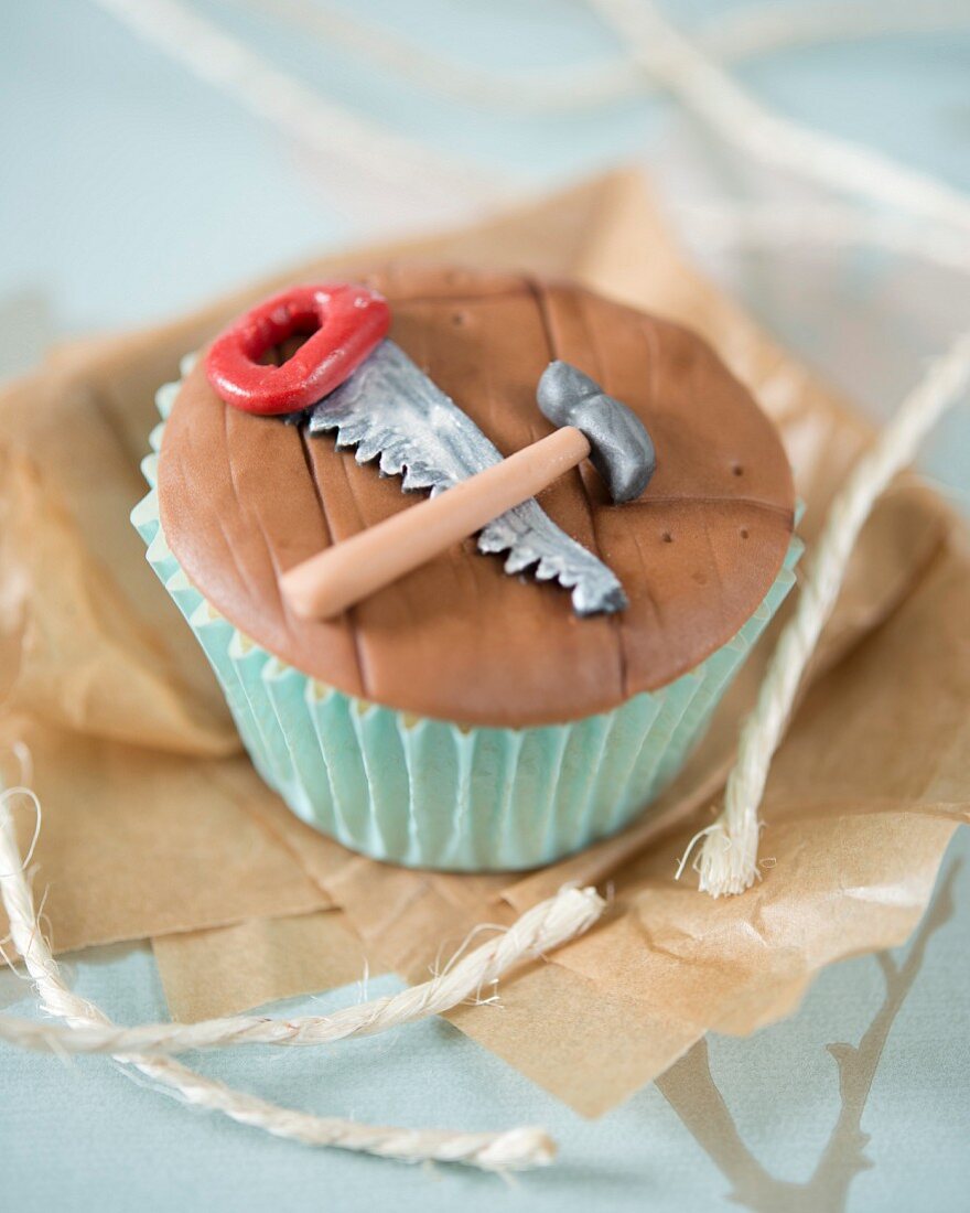 A carpentry themed cupcake