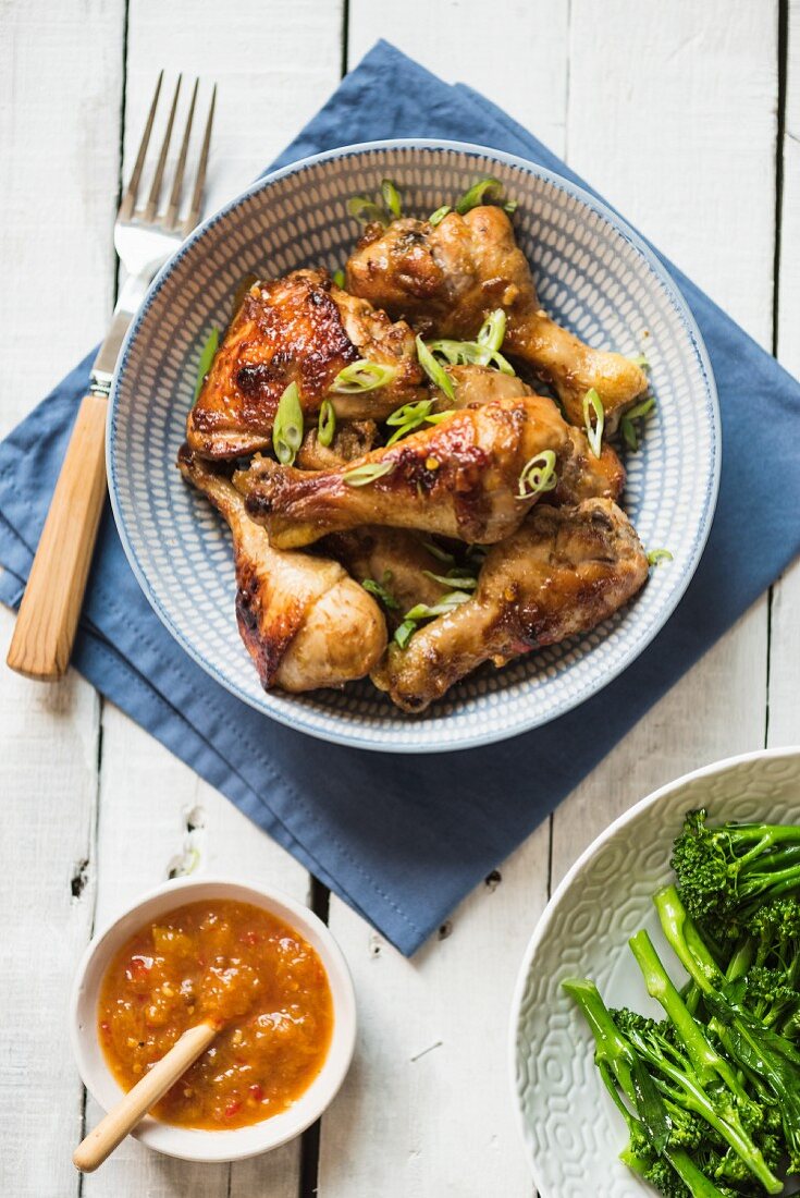 Chicken legs with mango sauce and broccoli