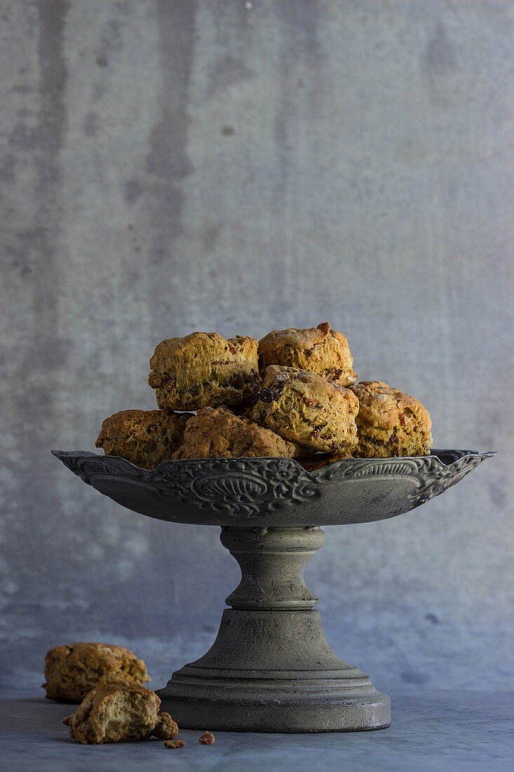 Spelt scones with raisins and cranberries in a grey bowl