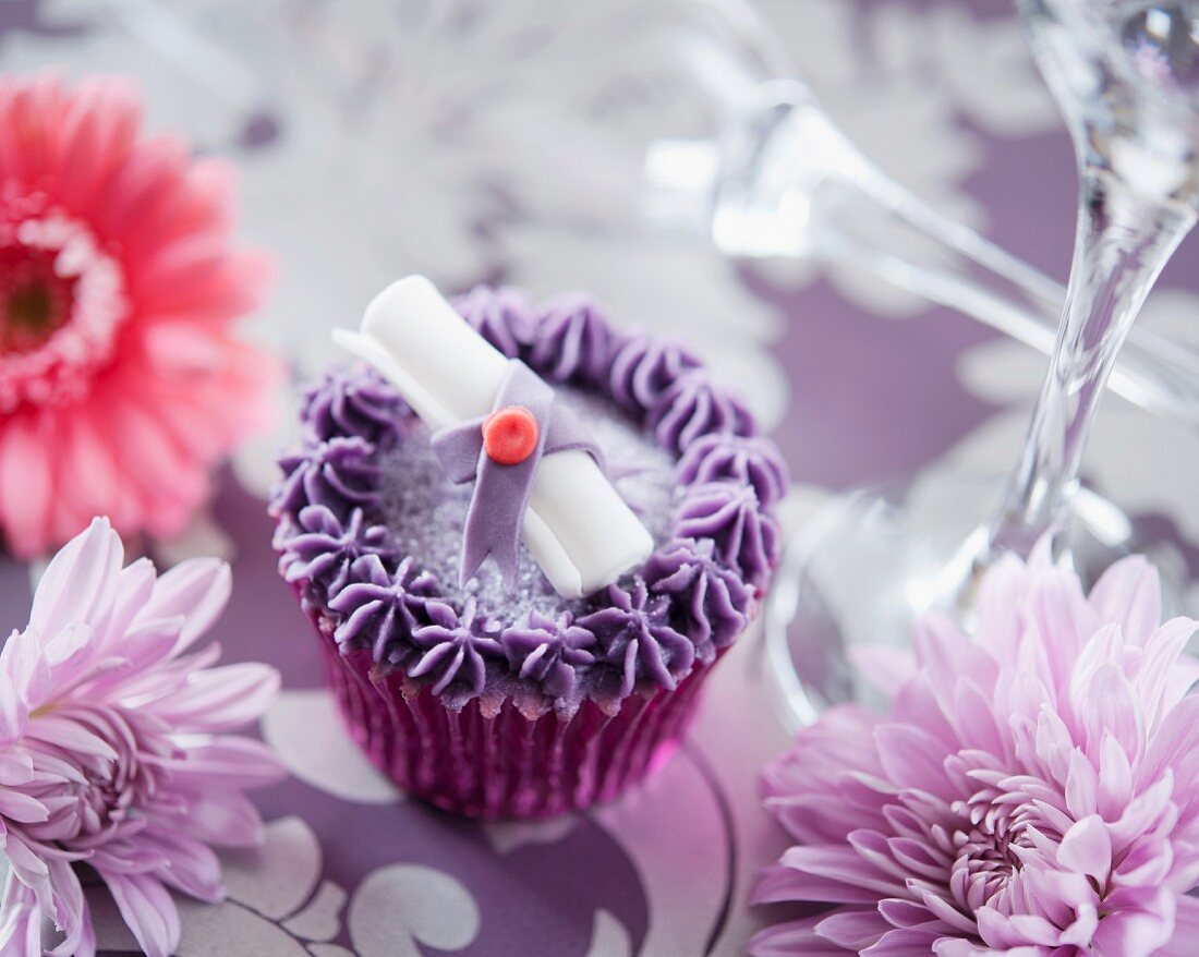 A purple graduation cupcake