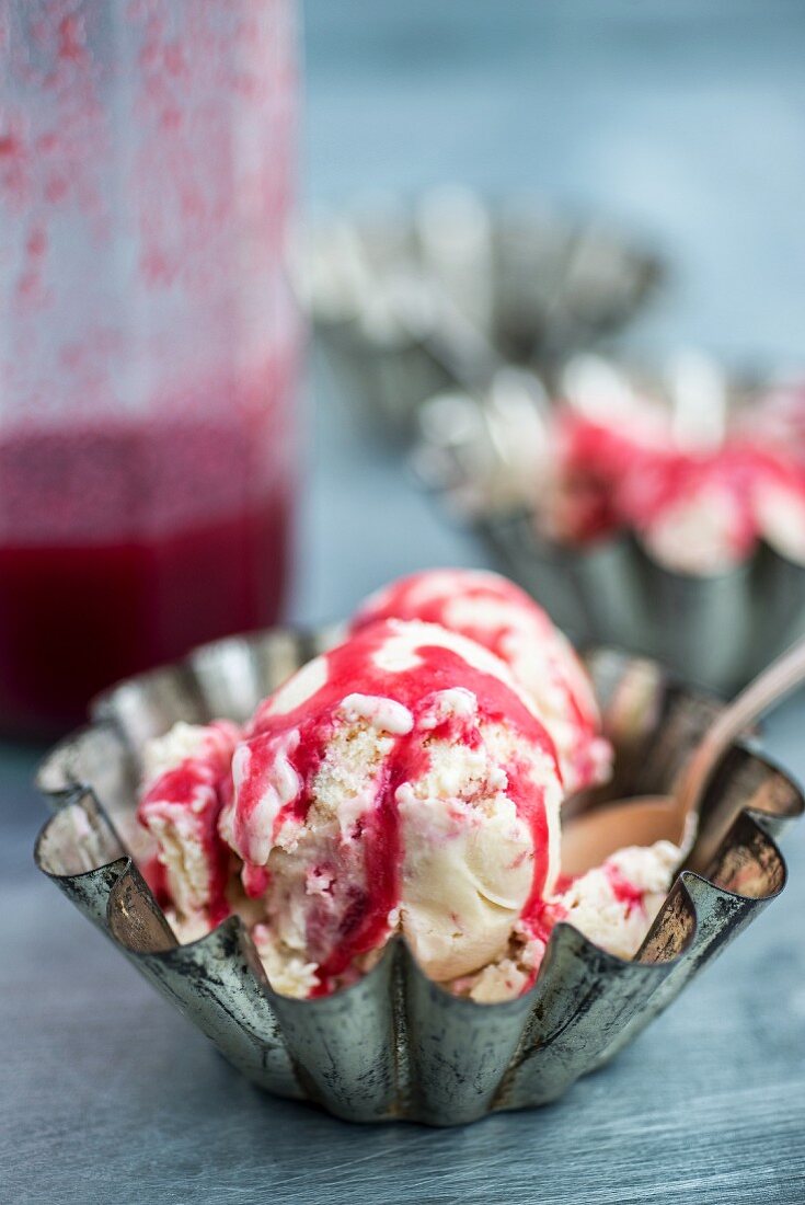 Raspberry and rhubarb ice cream with raspberry sauce