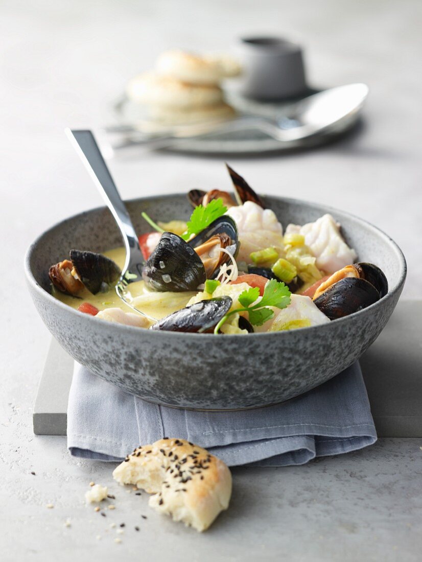 Diced cod with mussels in a coconut and lemongrass broth with unleavened bread