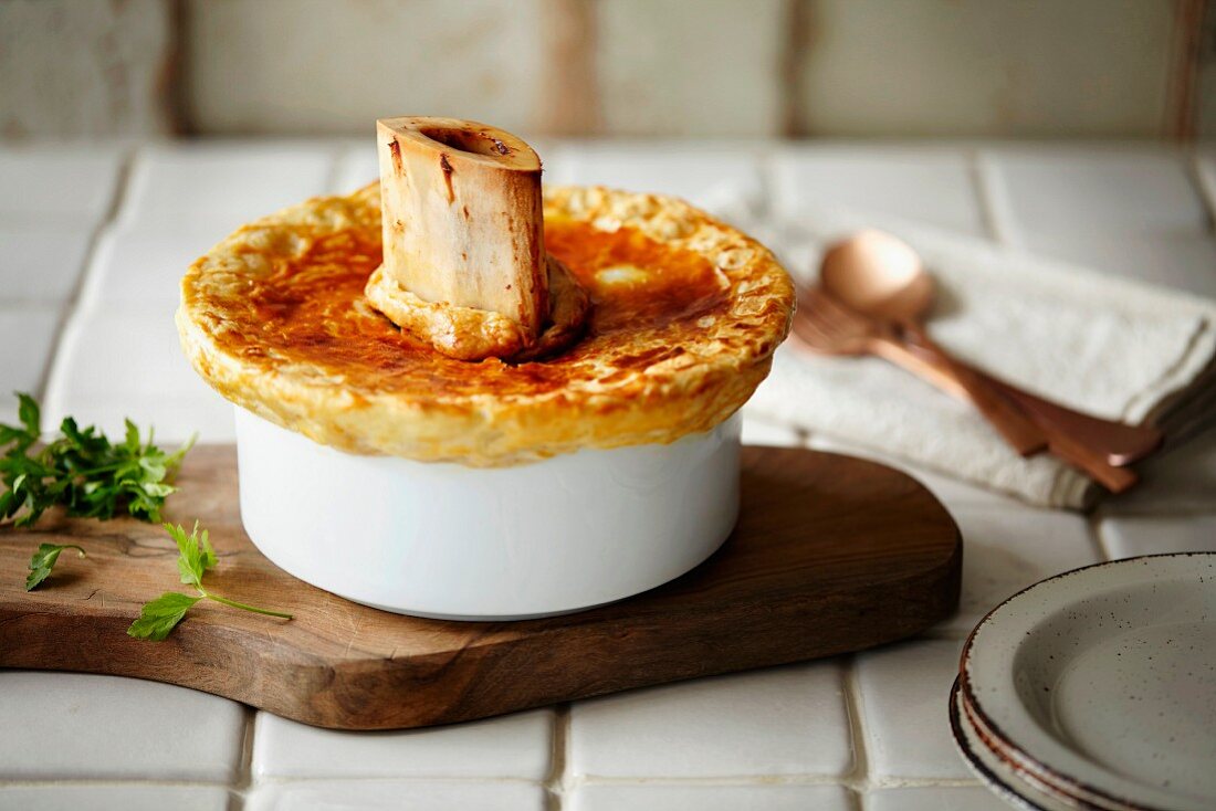 A pot pie with a beef bone