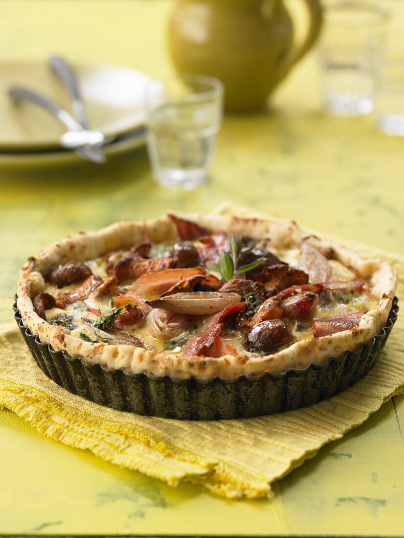 An autumnal tart with chestnuts, onions and bacon