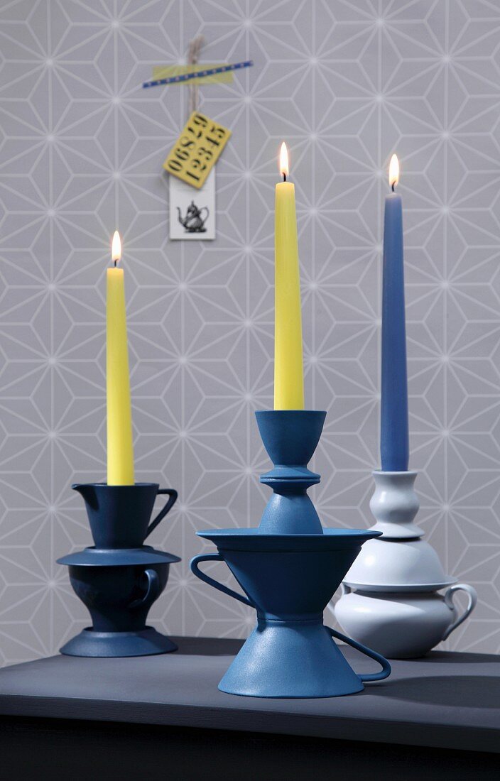 Hand-crafted candlesticks made from old china crockery painted and stuck together