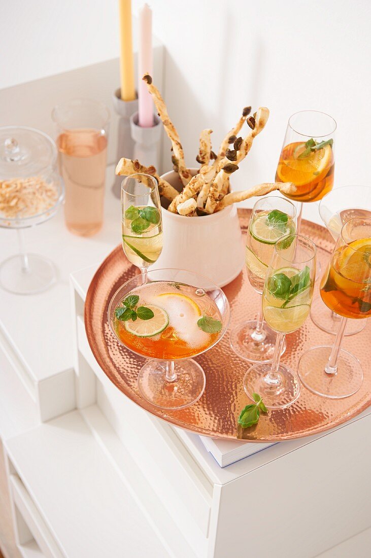 Aperol punch, Lillet tonice and wasabi sticks on a tray