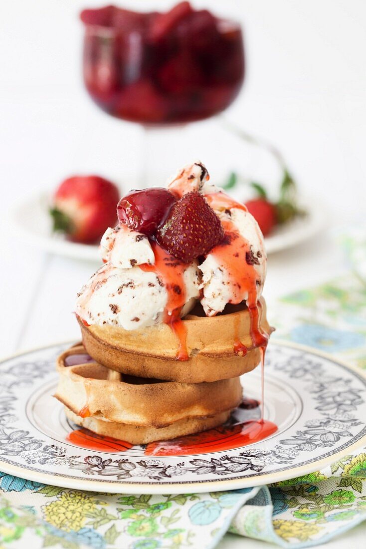 Waffles with ice cream and strawberries in syrup with cardamom and rose water