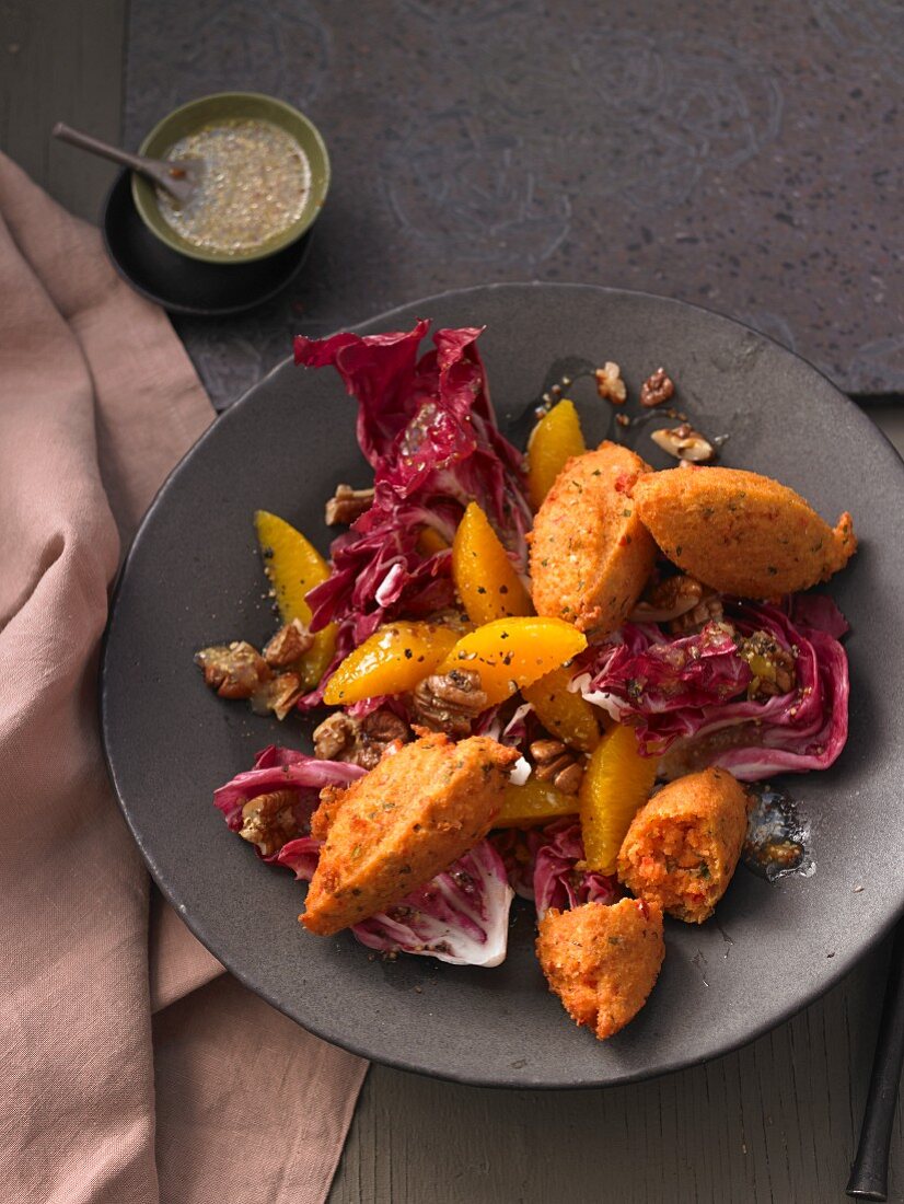 Chicory salad with lentil falafel, pecan nuts and oranges
