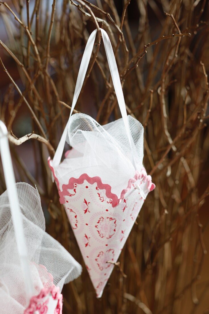 Christmas decoration cones made from lampshade film and fabric remnants filled with tulle