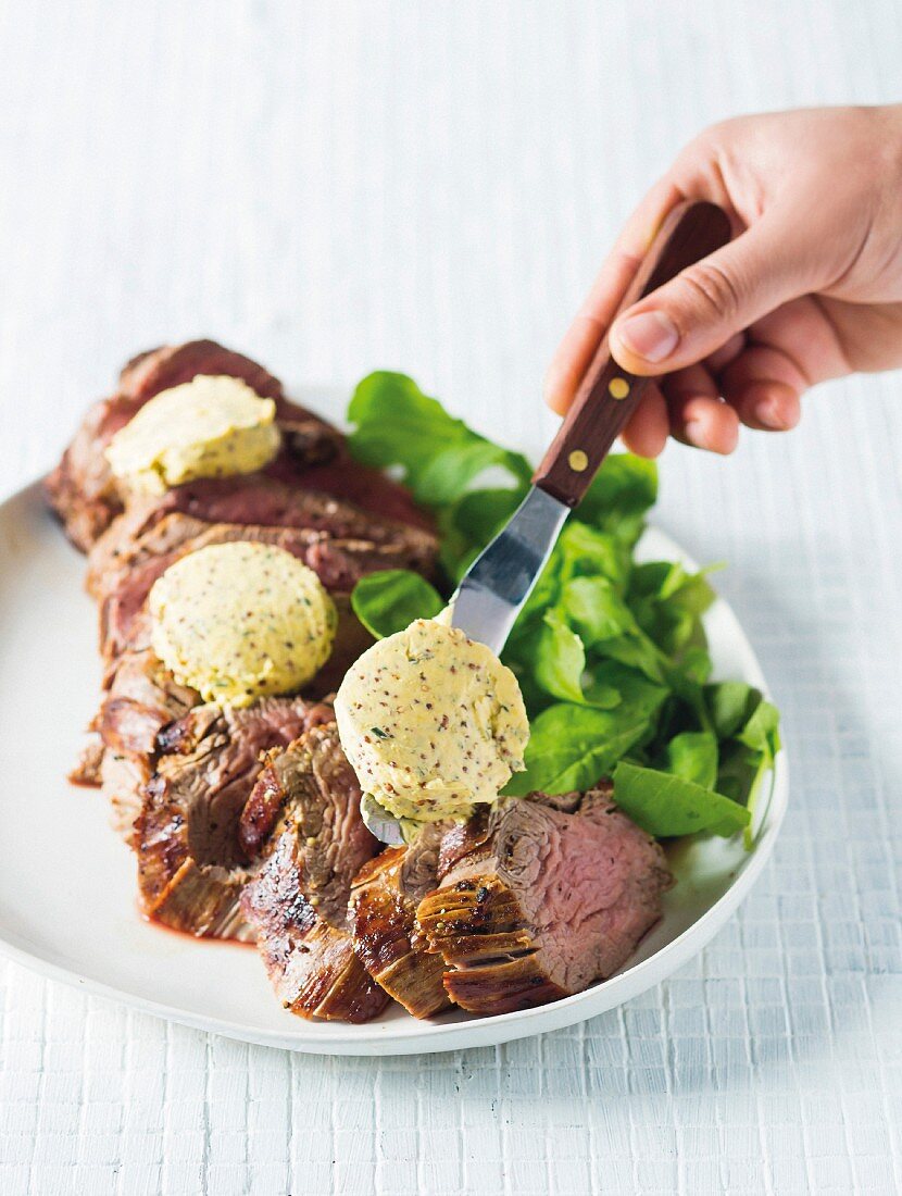 Roast beef fillet with rosemary and mustard butter