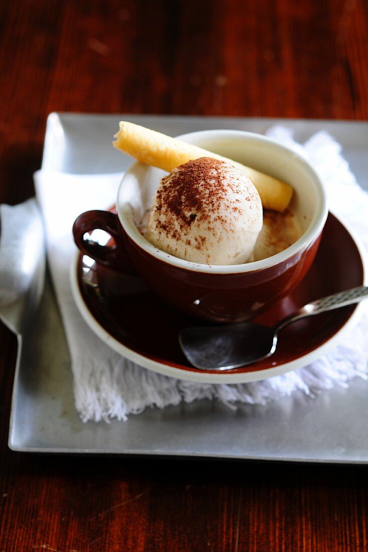 Espresso affogato with a scoop of vanilla ice cream and a wafer