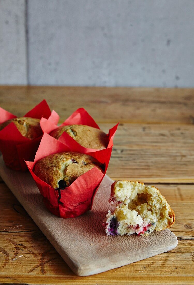 Raspberry muffins in red paper cases