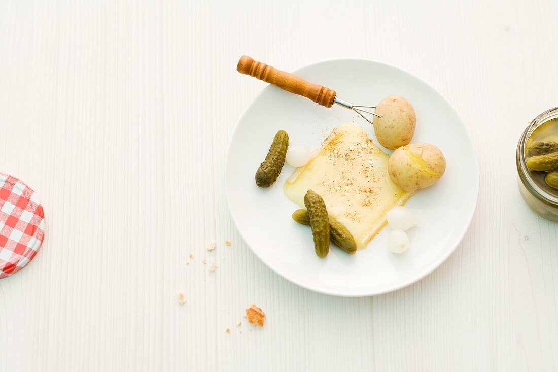 Raclette with potatoes and gherkins
