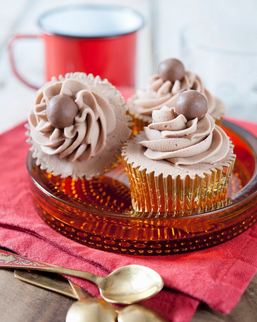Cupcakes decorated with chocolate mousse and Malteasers