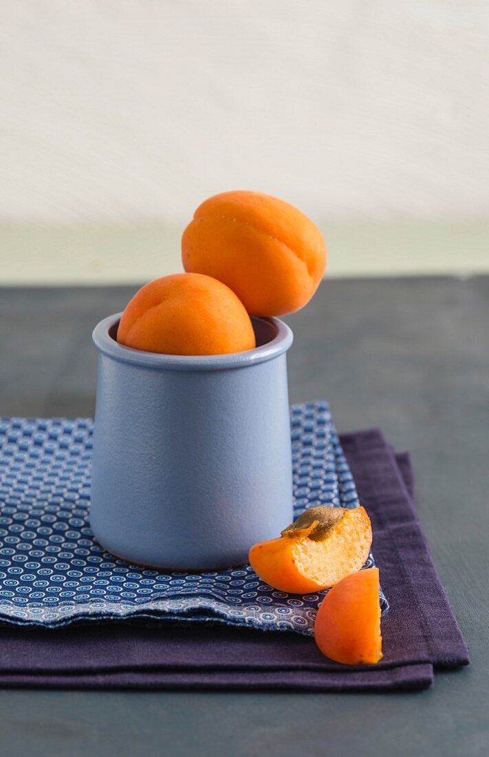 Fresh apricots in a mug