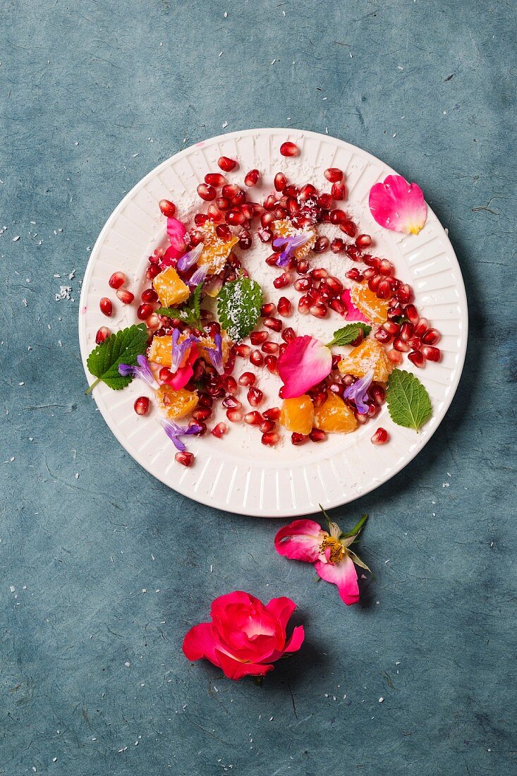 Orange and pomegranate salad with rose petals, mint and grated coconut