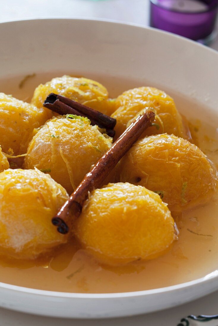 Candied yellow plums in a spicy broth