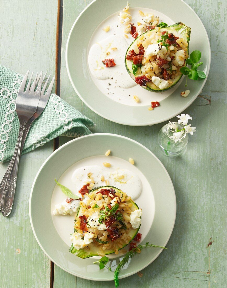 Round courgette filled with wild herb wheat, sheep's cheese and dried tomatoes