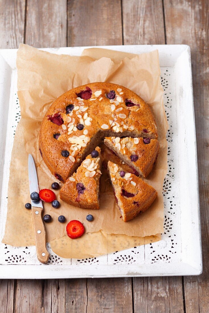 Almond cake with strawberries and blueberries