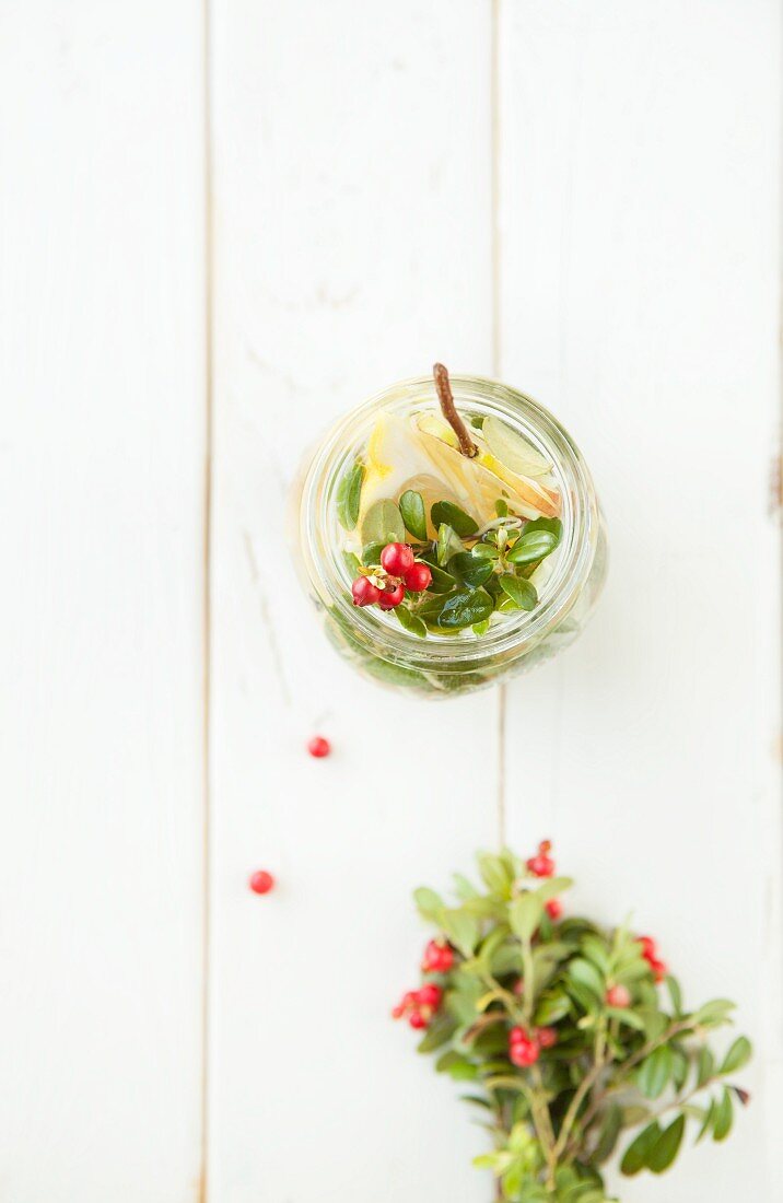 Hot drink with cranberries, ginger, pear, lemon and lavender honey