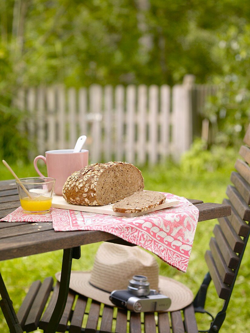 Wholemeal bread, sliced, on a garden table