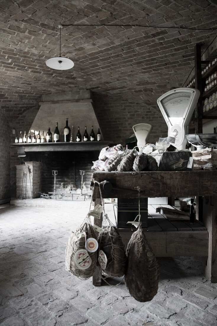 Wine and meats in a rustic, countryside delicatessen