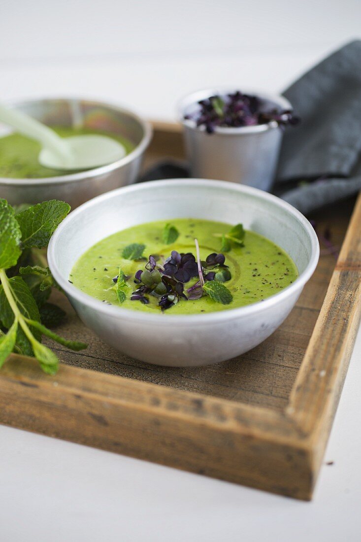 Pea and coconut soup with mint and daikon radishes