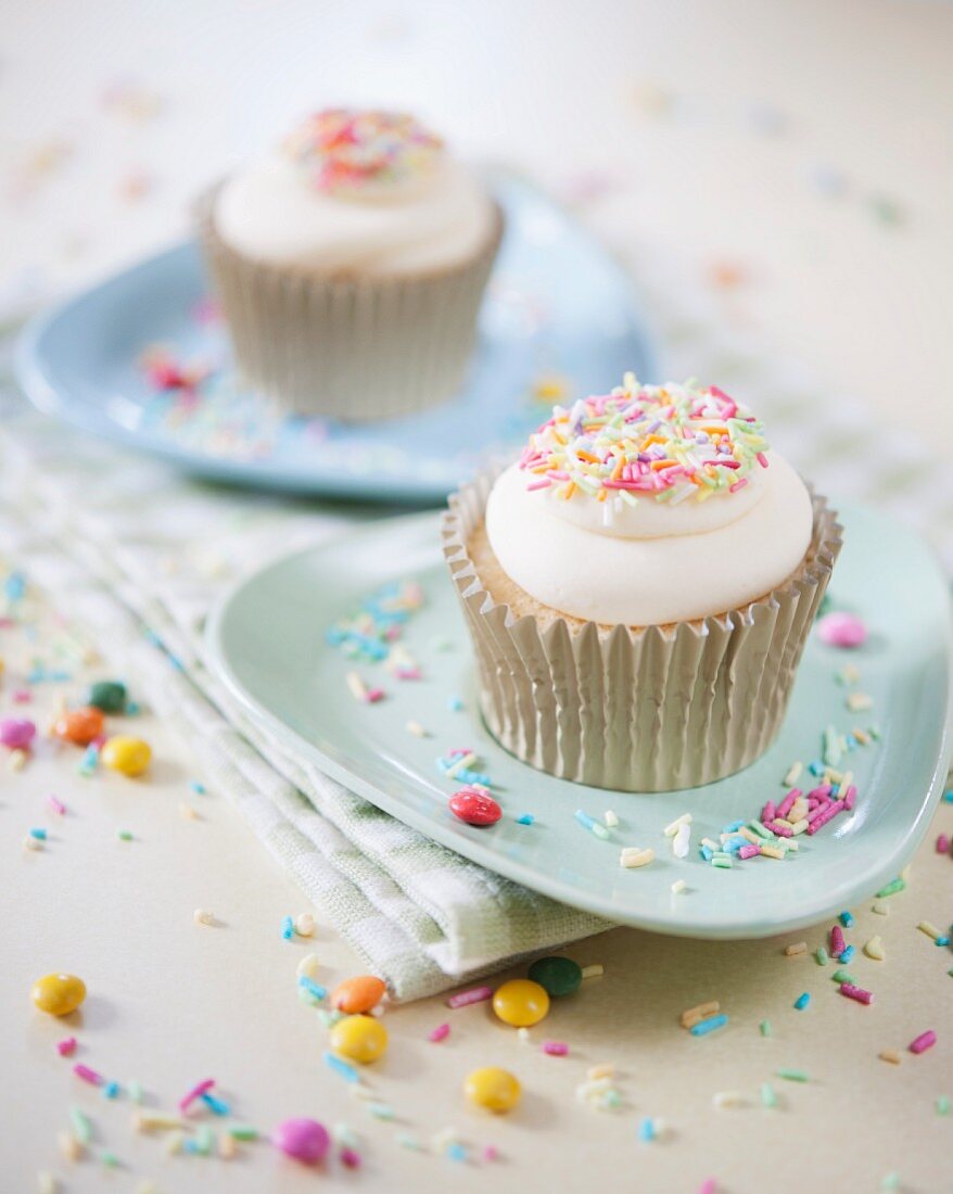 Vanilla cupcakes with coloured sugar sprinkles