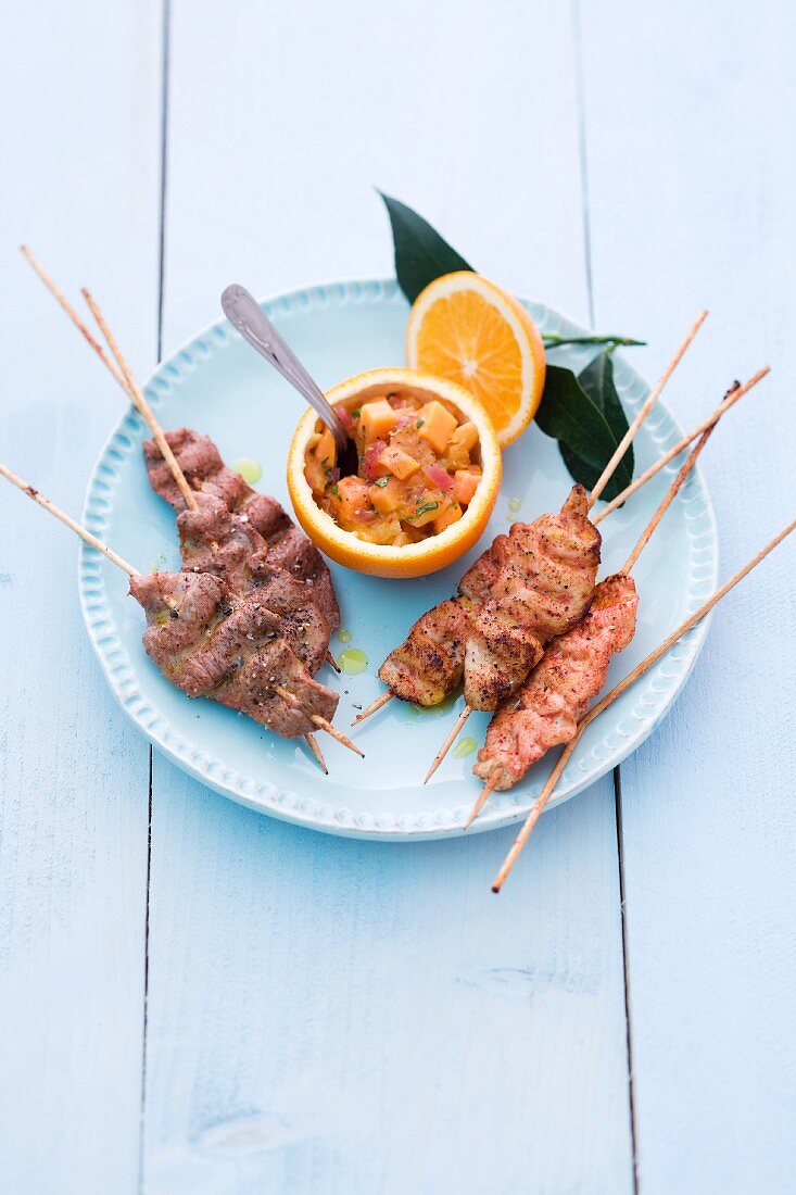 Papaya and orange chutney with chicken and veal skewers
