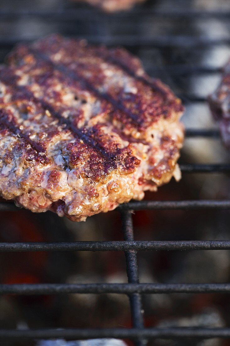 A burger on a grill