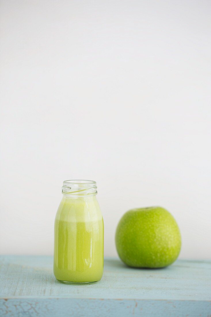 Green juice made from Granny Smith apples, limes and ginger