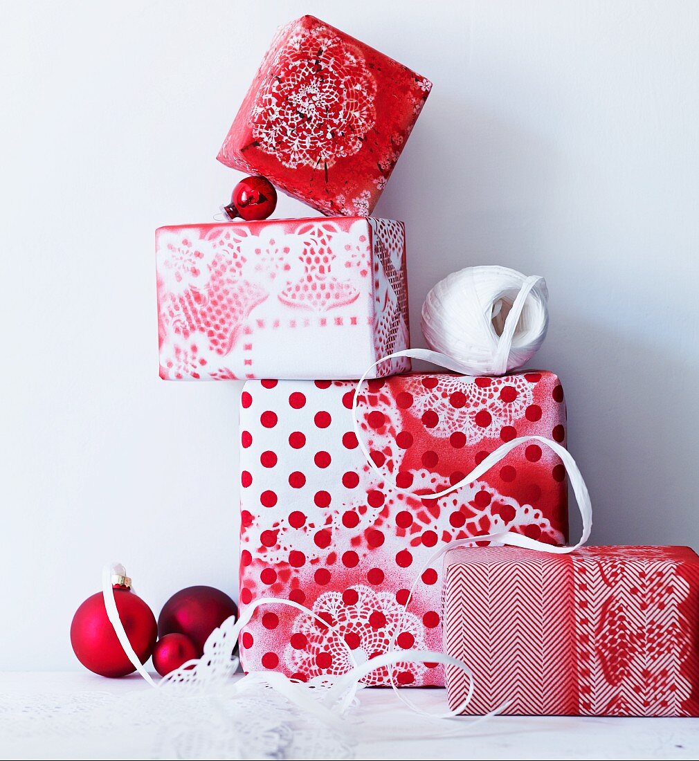 Gifts wrapped in hand-made paper with different patterns of red and white