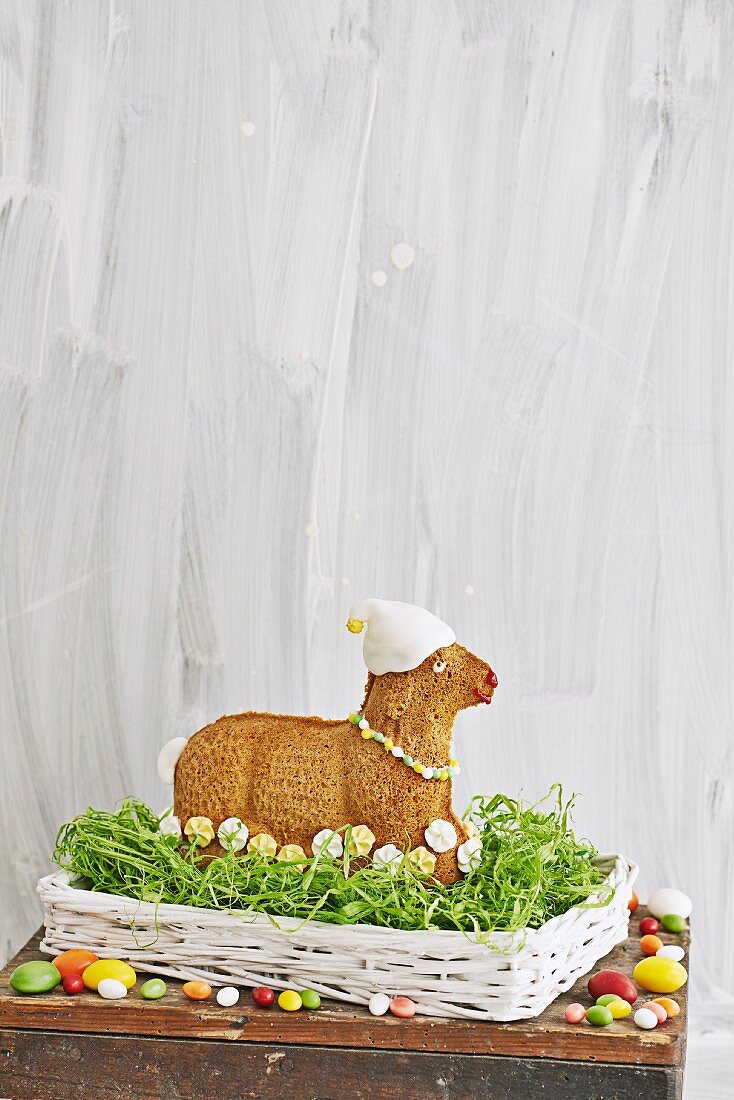Easter lamb cake in nest decorated with sugar flowers & fondant icing