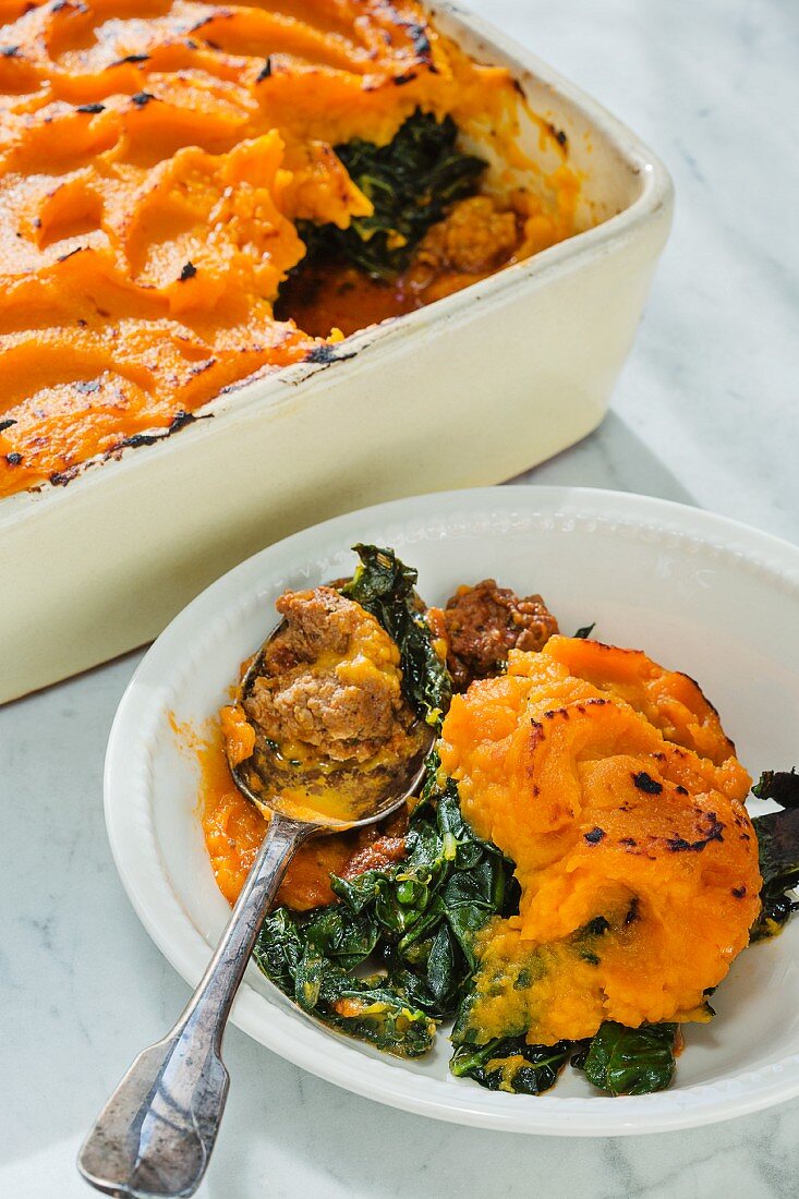 Minced emu bake with kale and a sweet potato topping