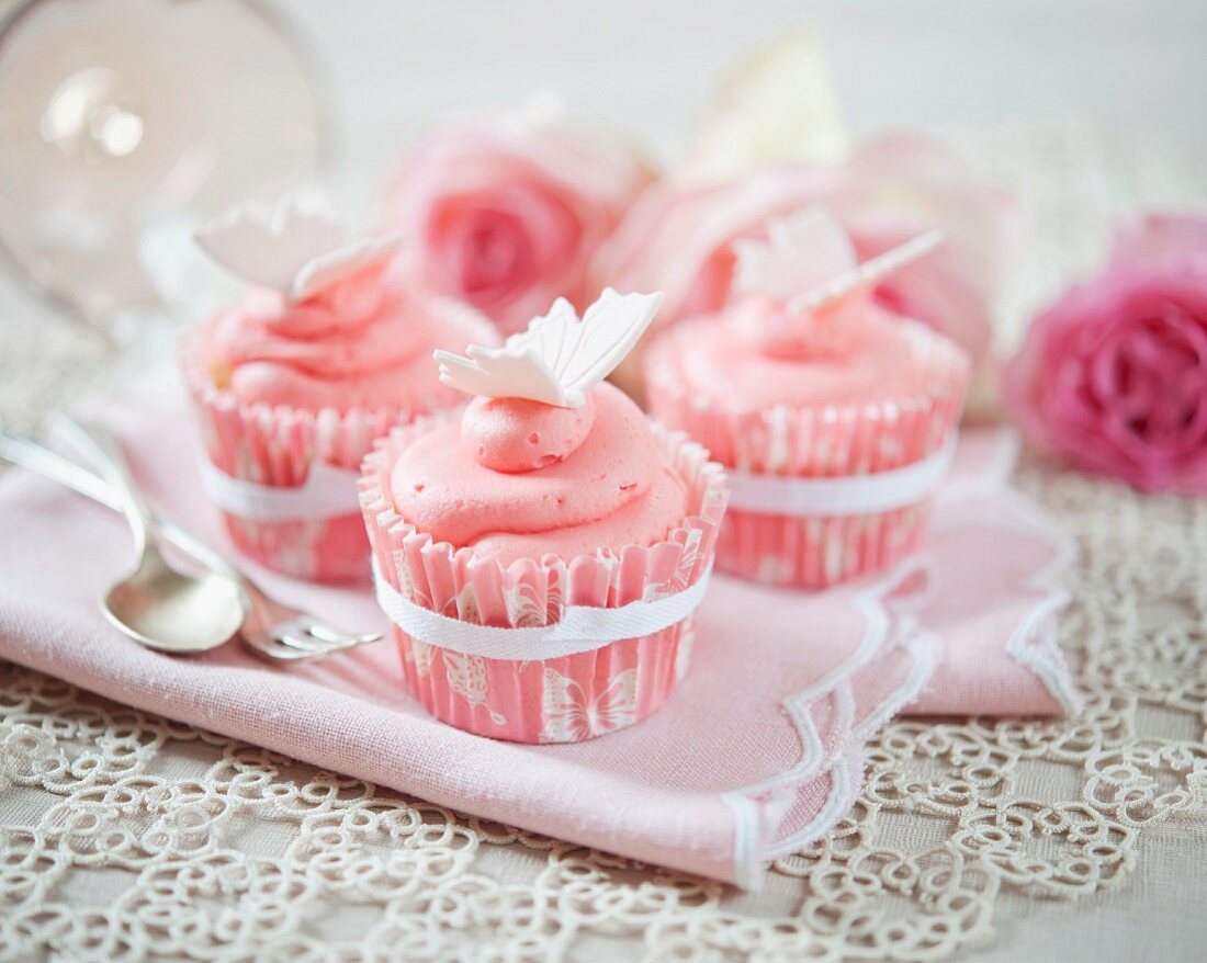 Strawberry cream cupcakes decorated with butterflies